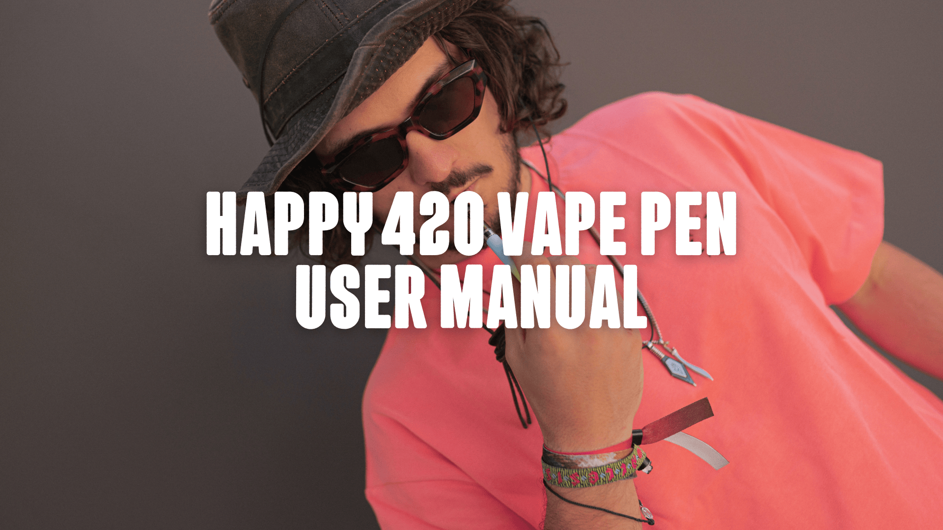A guy in a pink shirt and hat vaping